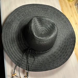 Black woven straw hat. No size or brand tag. No rips or stains.